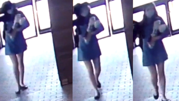 Kathleen Riethmuller Removing Her Hat