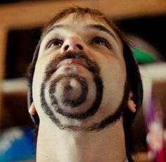 A man with a beard cut into a spiral shape